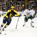 Michigan sophomore right wingman Andrew Sinelli moves the puck up the ice in the game against Michigan State at Joe Louis Arena on Saturday, Feb. 2. Daniel Brenner I AnnArbor.com